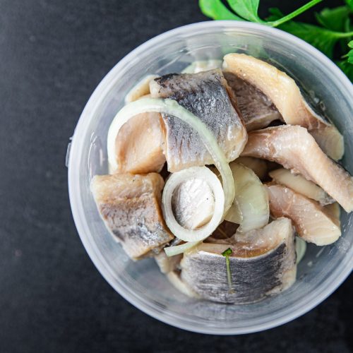 herring piece salted plate seafood fish food on the table